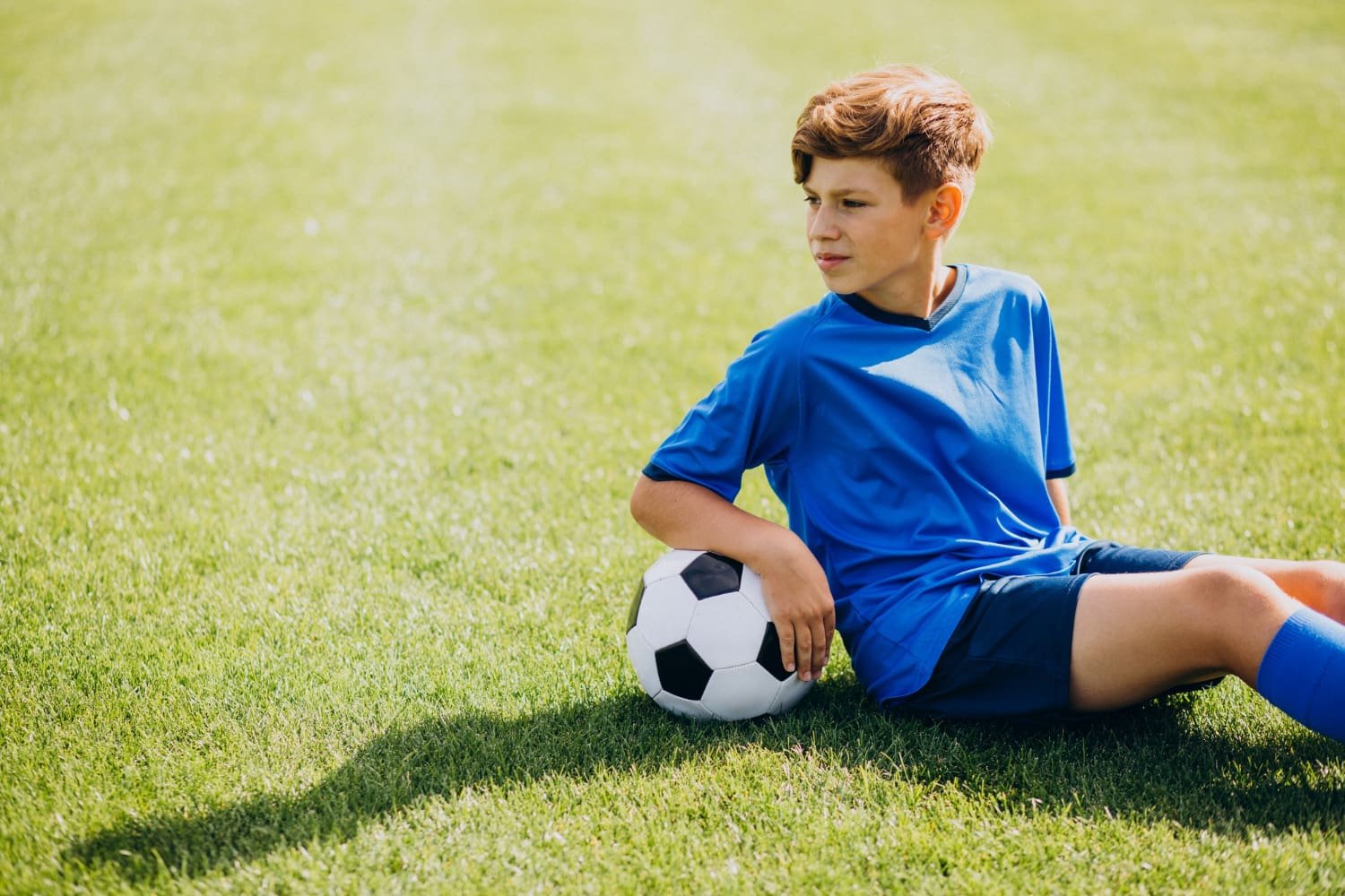 Focused Football Player in Action on the Open Field